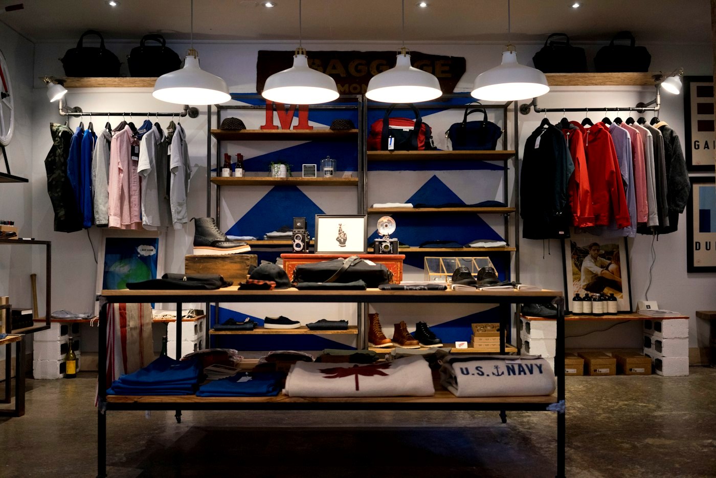 Inside a menswear boutique, shirts hanging on rails
