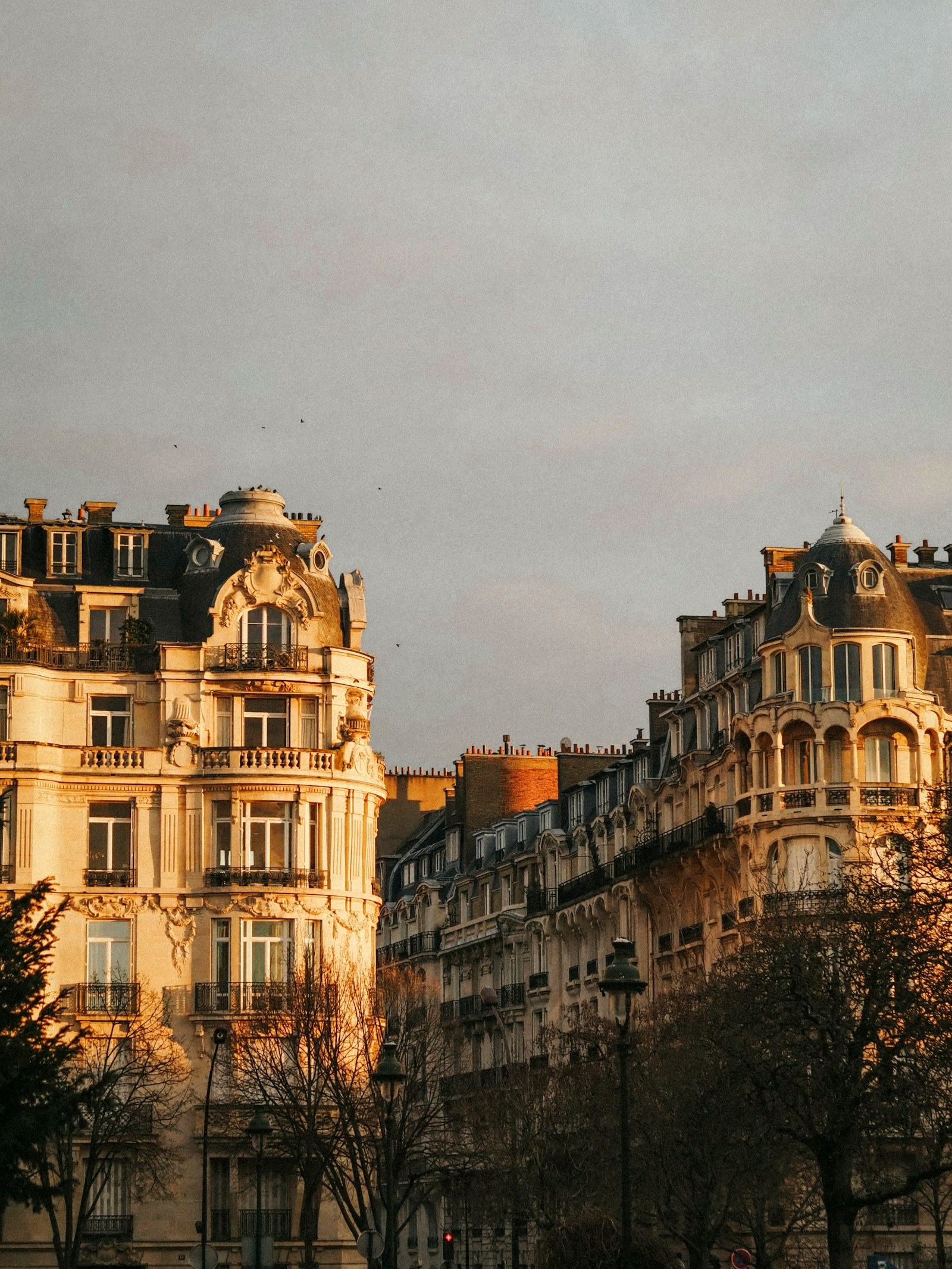 Ornate Haussmann facades in golden evening light, Paris