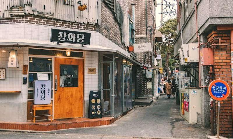 A corner café storefront in soft afternoon light