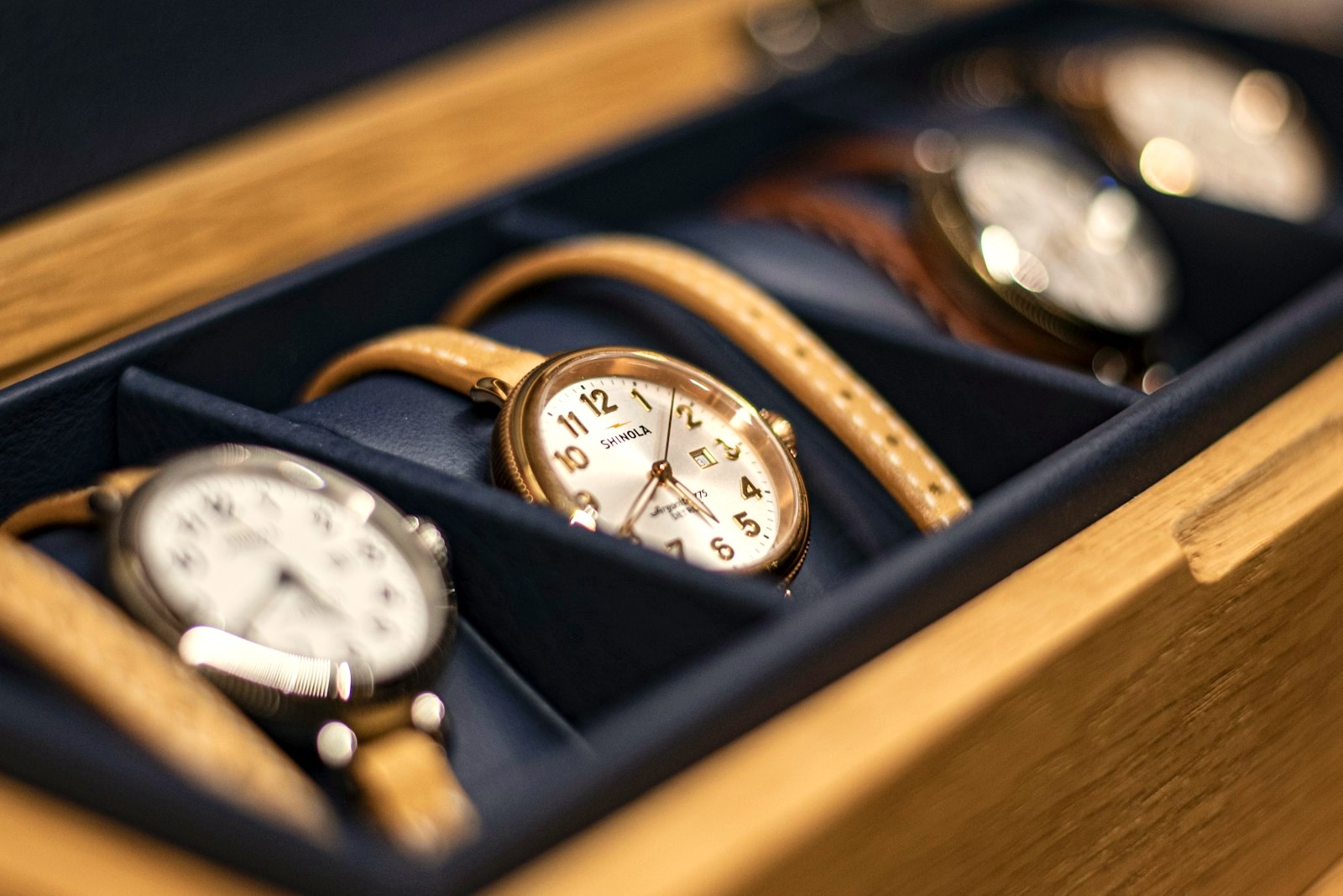 Watches kept in a wooden collection box tray, the keeper's shelf